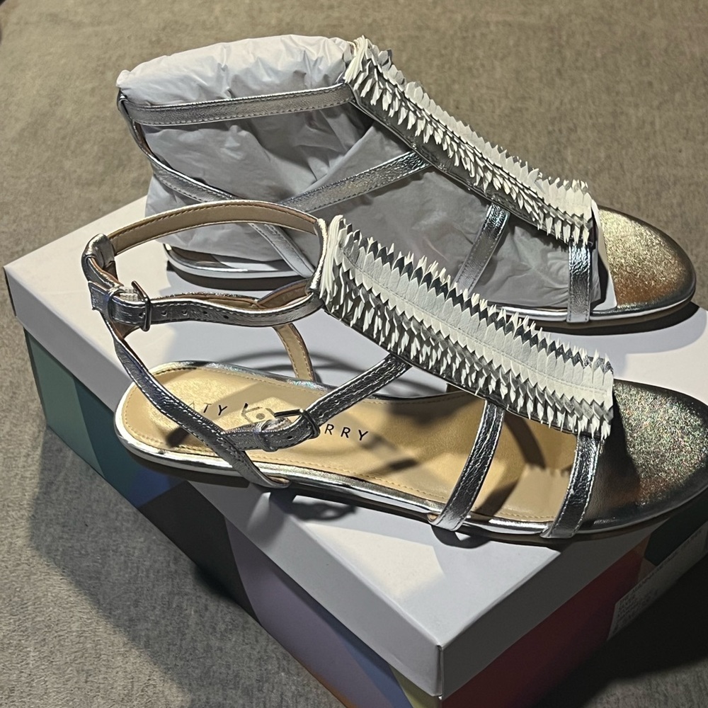 Katy Perry sliver metallic leather sandals.